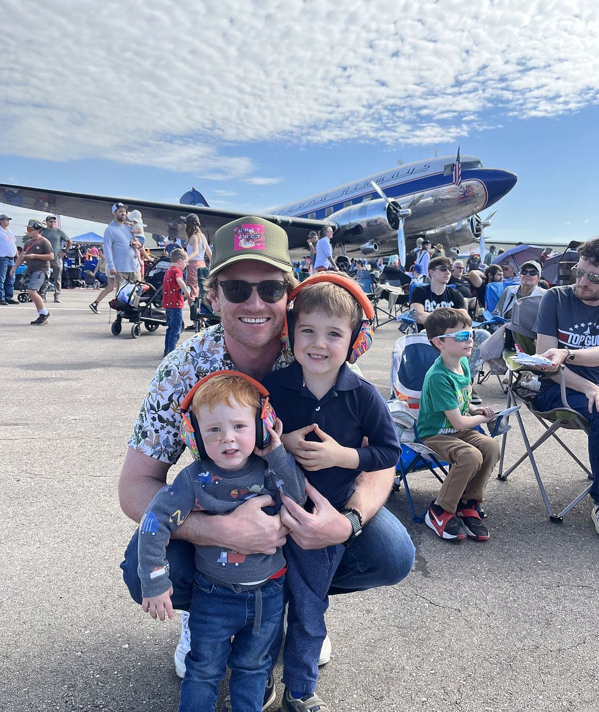 Kevin, the founder of Black Bear, with his two kids at a Colorado air show.